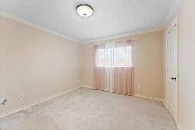 a view of a brick house with many windows