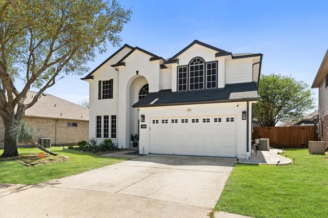 a bed room with a bed and a chandelier