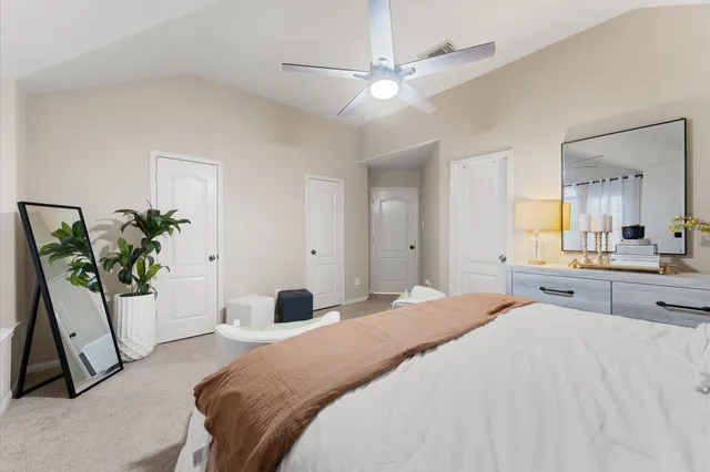 a bathroom with a bathtub a sink and a mirror