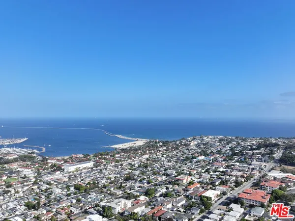 a view of a kitchen with a sink and dishwasher cabinets