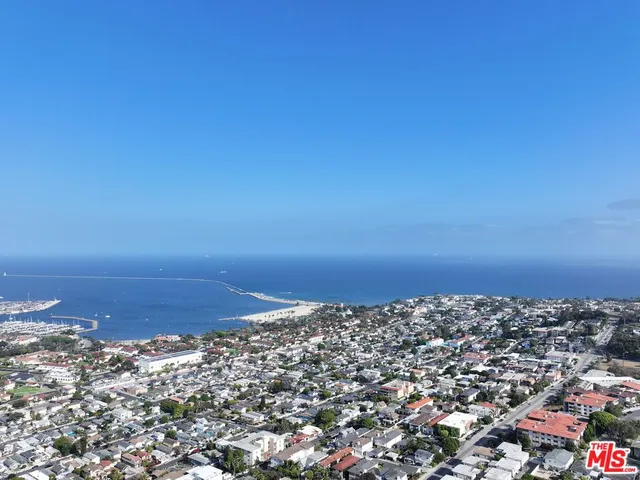 a view of a kitchen with a sink and dishwasher cabinets
