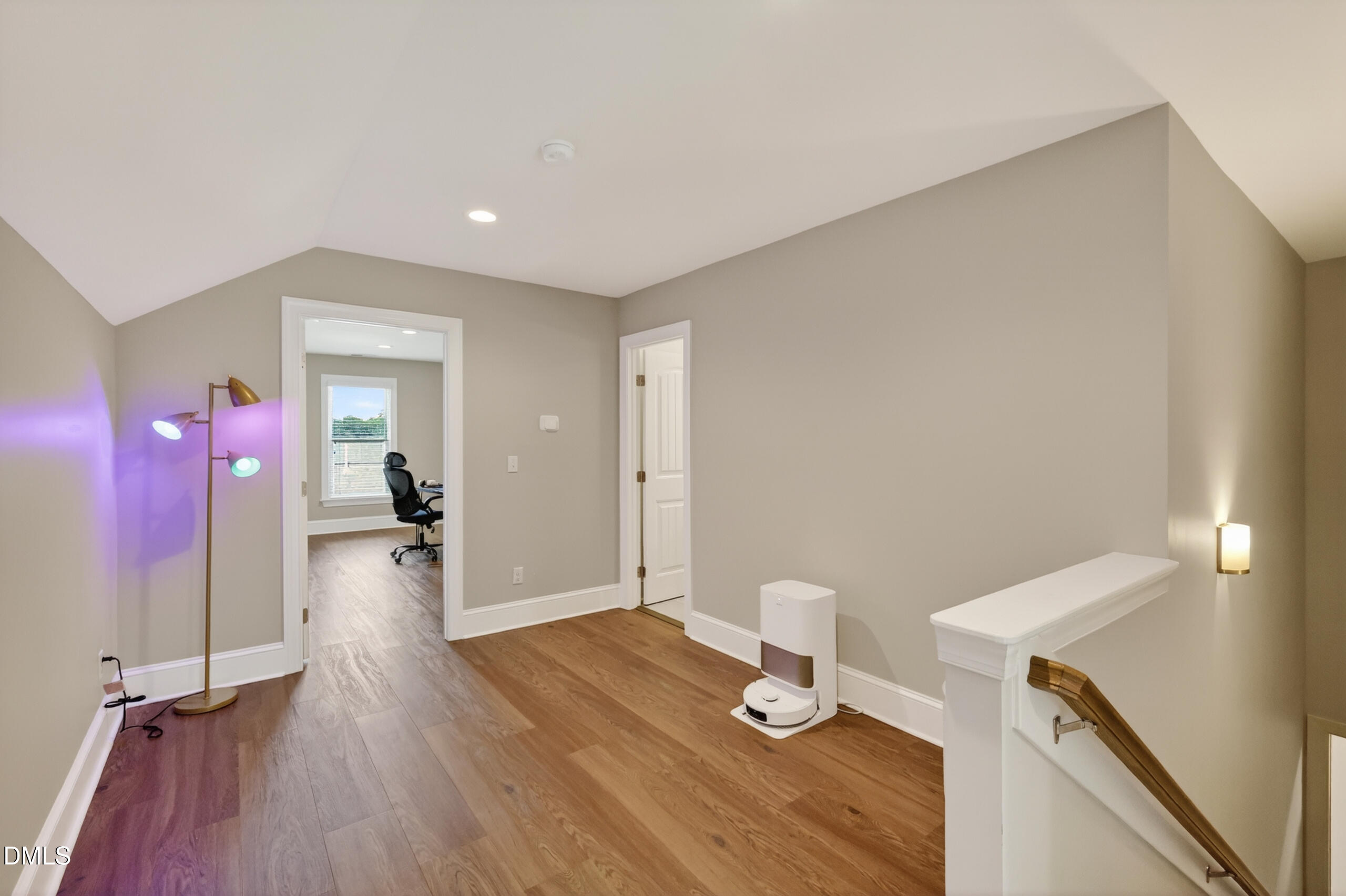 261 Character Drive Rolesville, NC 27571 - Photo 51 of 77 a view of a hallway with wooden floor and furniture
