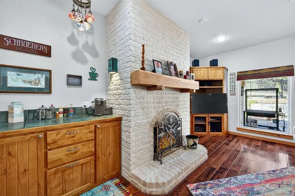a living room with furniture and flat screen tv