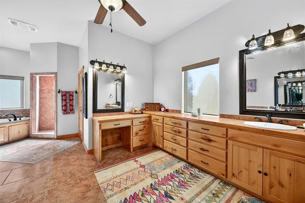 a spacious bathroom with a double vanity sink mirror and