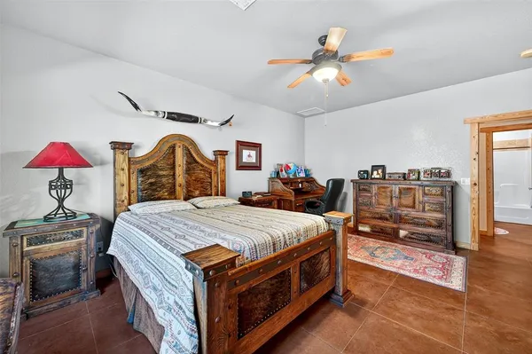 a bed room with a bed and a chandelier