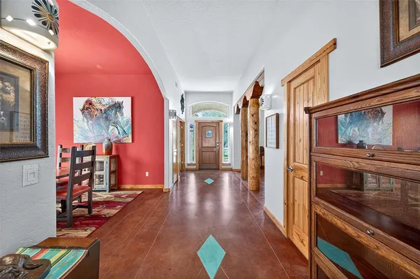 a view of an entryway with wooden floor and windows