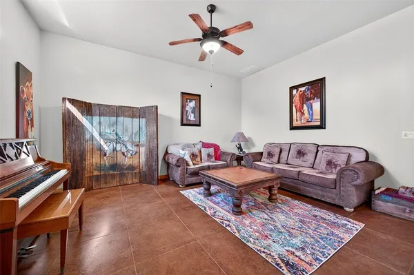a living room with furniture and a rug