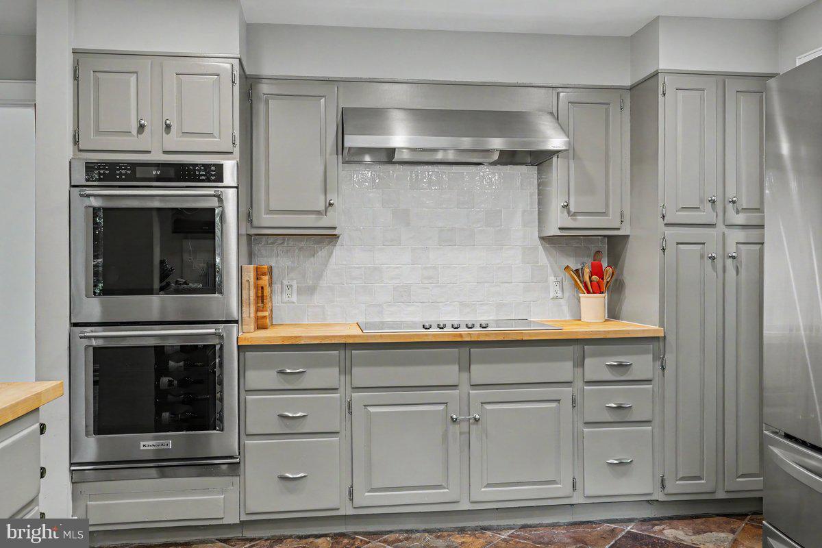 13 High Road New Hope, PA 18938 - Photo 10 of 56 a kitchen with stainless steel appliances granite countertop a refrigerator oven and white cabinets