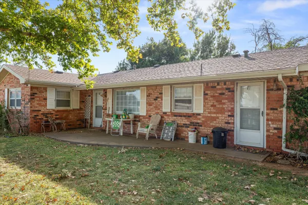 a house view with swimming pool in front of it