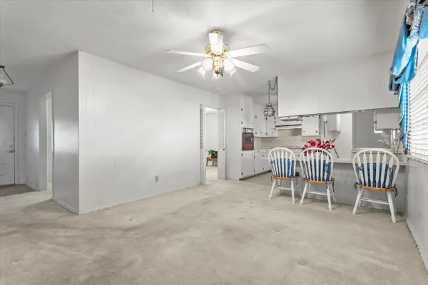 a kitchen with kitchen island granite countertop a sink stainless steel appliances and cabinets