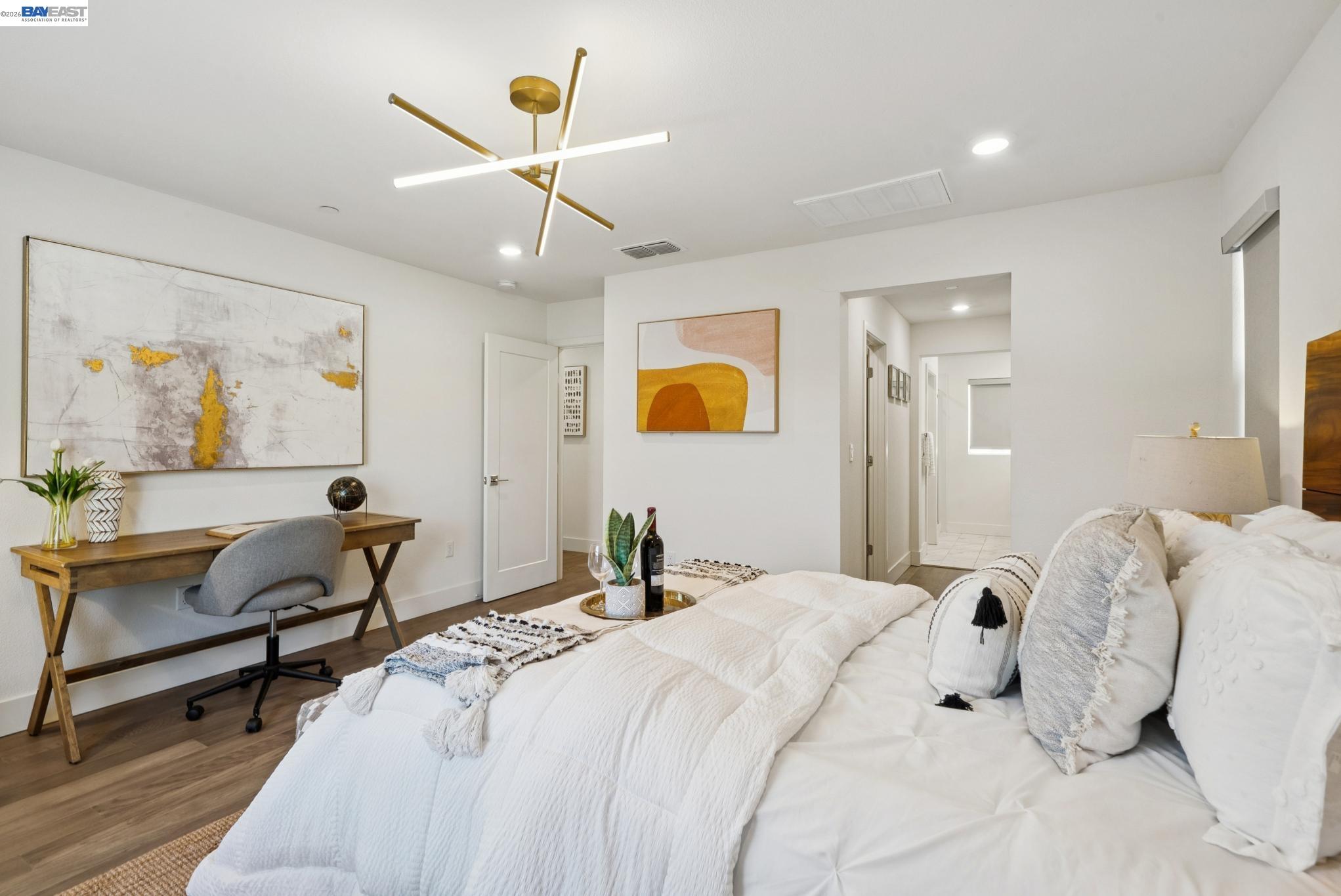57109 Via Vicenza San Ramon, CA 94583 - Photo 31 of 54 a bedroom with a bed and a chandelier