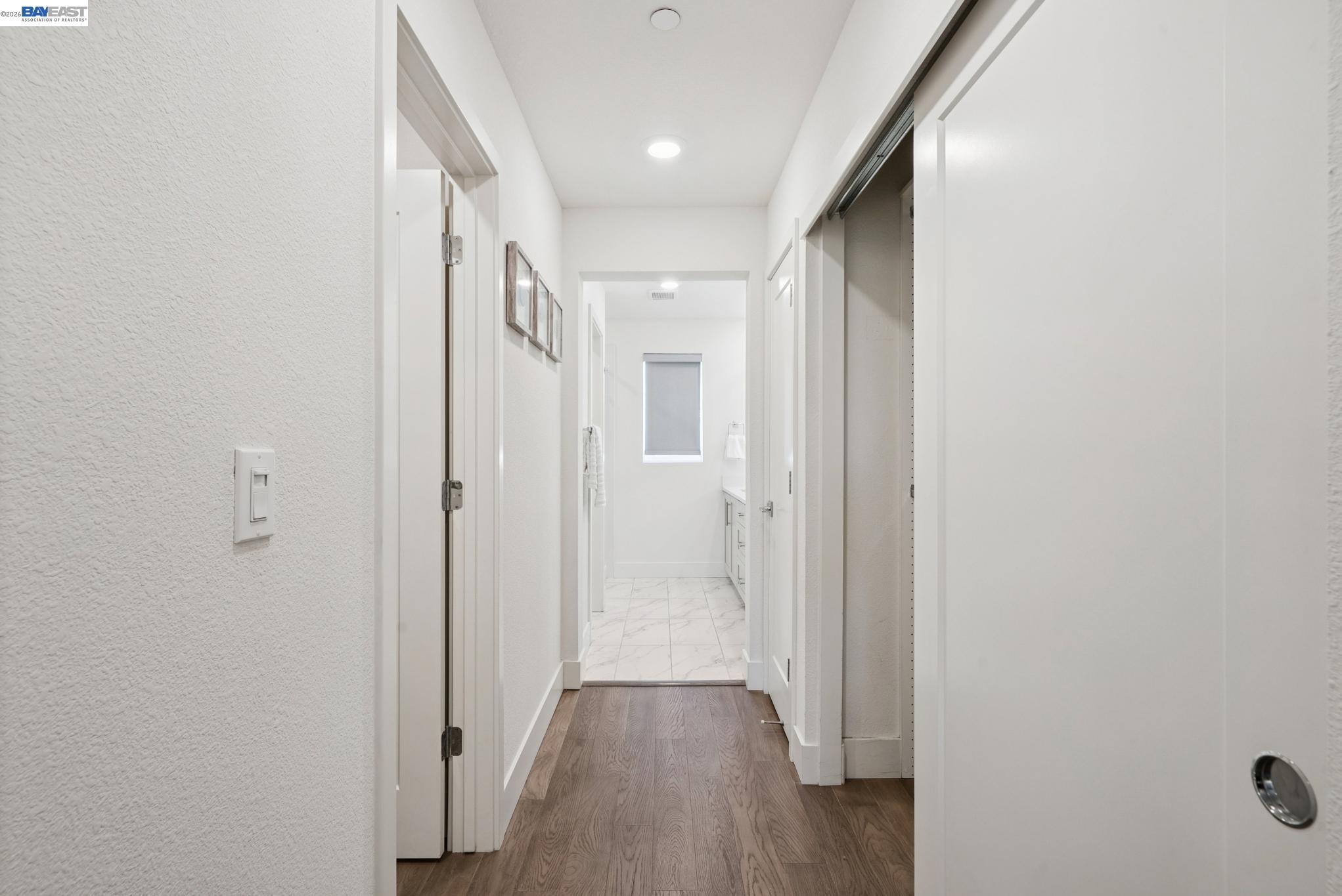 57109 Via Vicenza San Ramon, CA 94583 - Photo 33 of 54 a view of a hallway with wooden floor