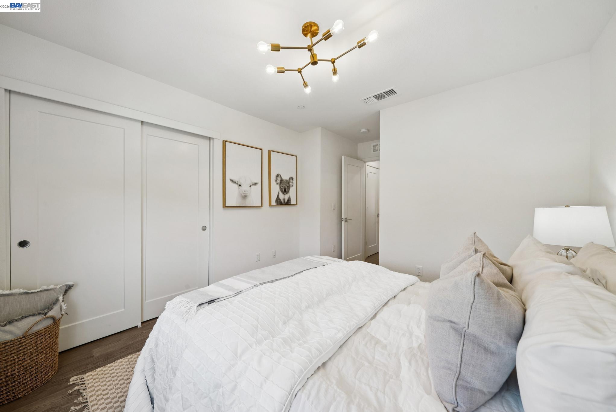 57109 Via Vicenza San Ramon, CA 94583 - Photo 42 of 54 a bedroom with a bed and a chandelier