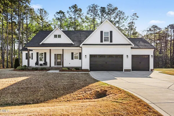 a front view of a house with yard