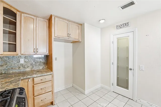 a view of cabinets and window