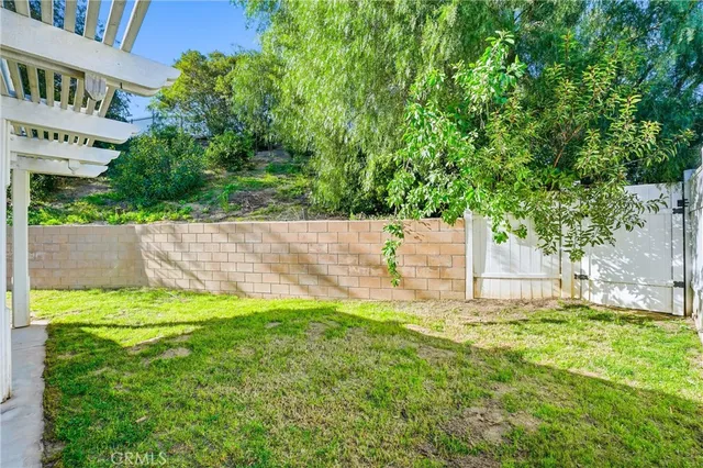 a view of a backyard with a small cabin