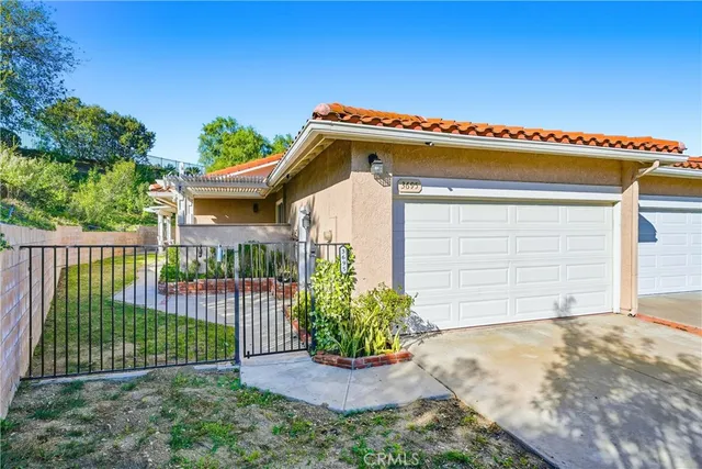 a front view of a house with a garage