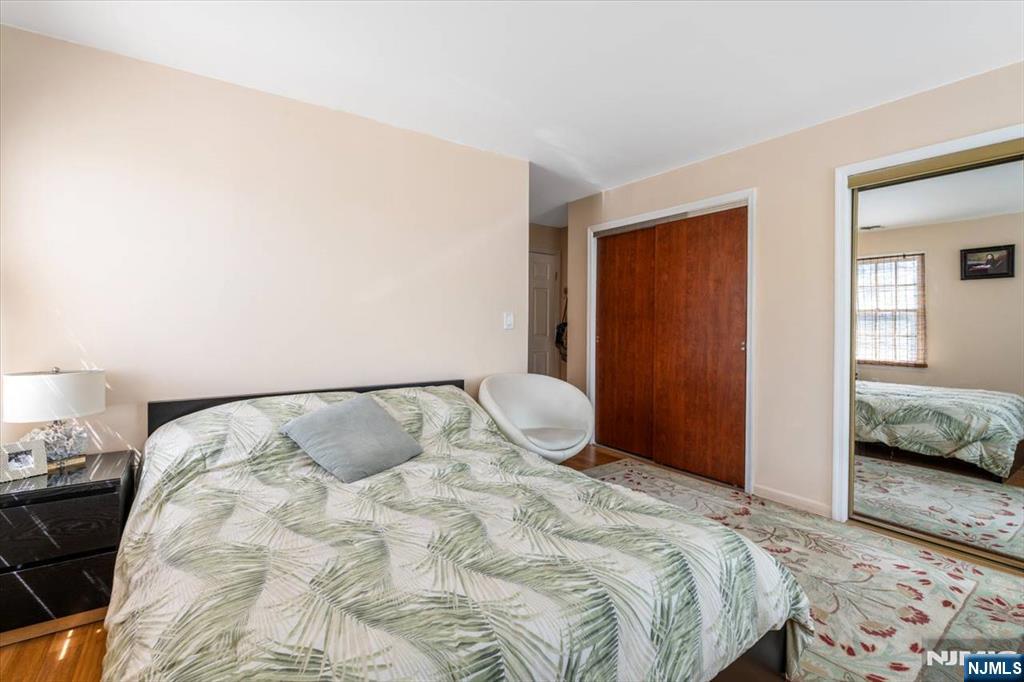 48 Quartz Lane Paterson, NJ 07501 - Photo 11 of 29 a bedroom with a bed and a lamp