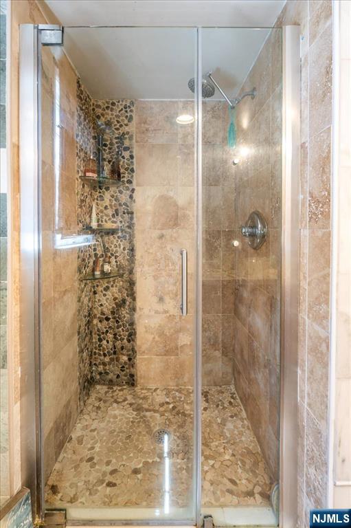 48 Quartz Lane Paterson, NJ 07501 - Photo 13 of 29 a bathroom with a glass door shower