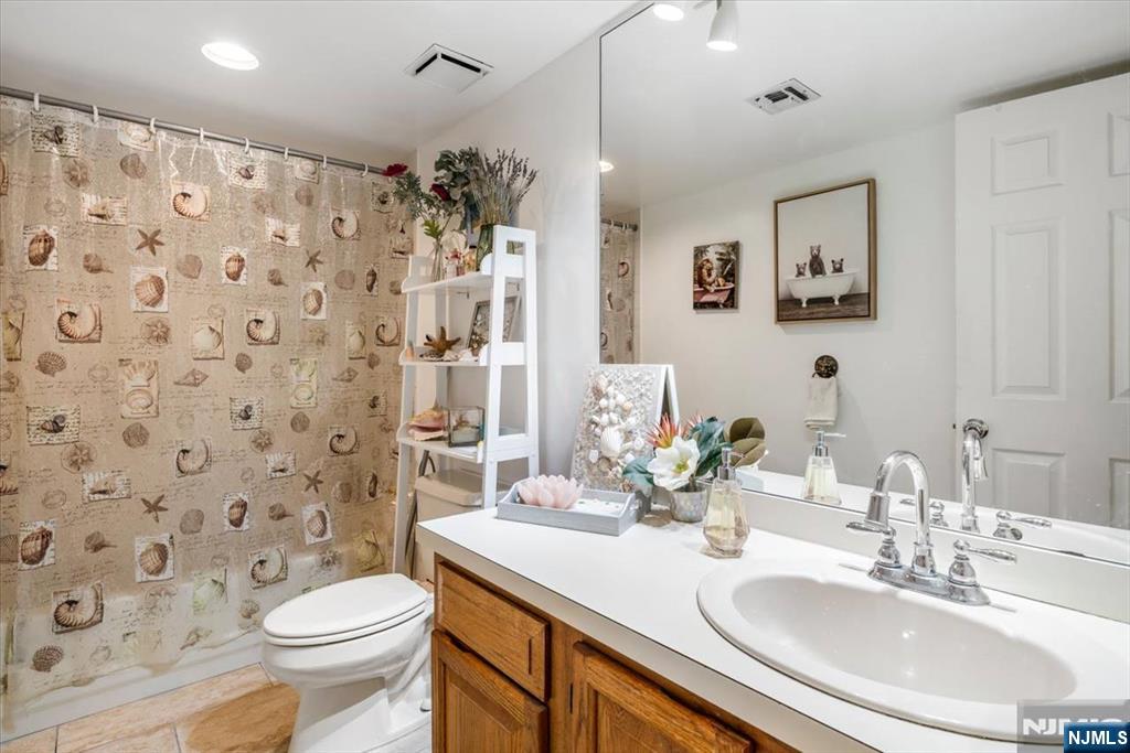 48 Quartz Lane Paterson, NJ 07501 - Photo 17 of 29 a bathroom with a sink toilet and shower
