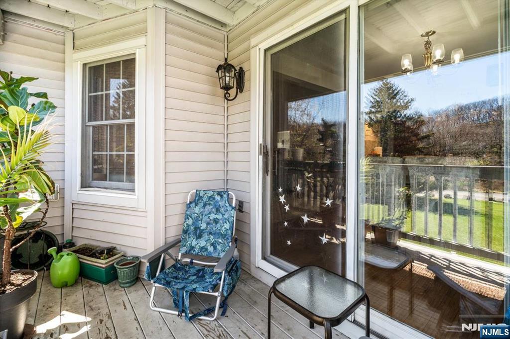 48 Quartz Lane Paterson, NJ 07501 - Photo 19 of 29 a porch with a table and chairs