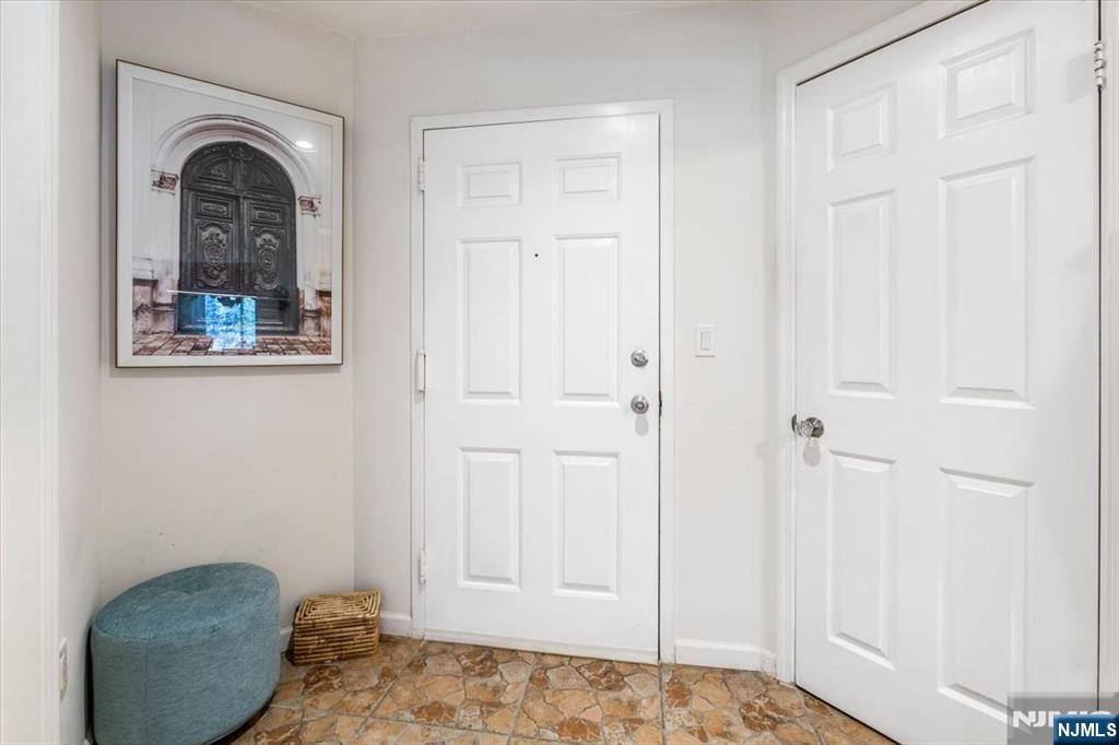 48 Quartz Lane Paterson, NJ 07501 - Photo 20 of 29 a bedroom with a bed and a painting on the wall