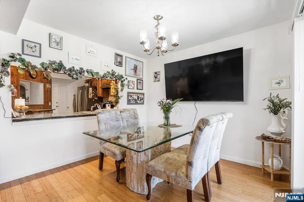 48 Quartz Lane Paterson, NJ 07501 - Photo 5 of 29 a view of a dining room with furniture and wooden floor