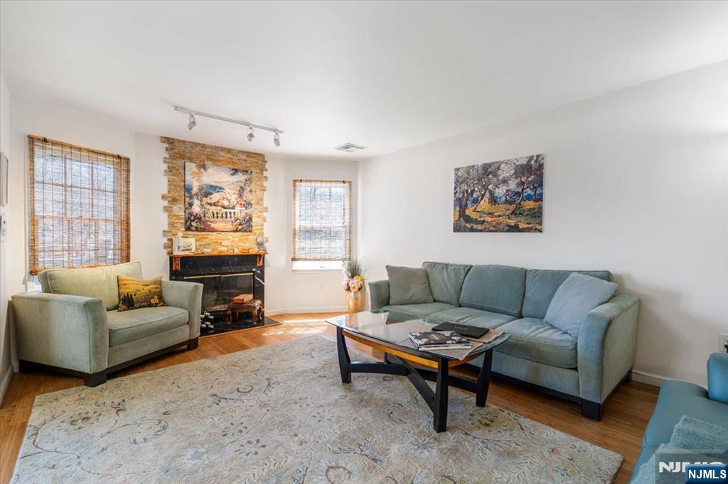 48 Quartz Lane Paterson, NJ 07501 - Photo 7 of 29 a living room with furniture and a fireplace