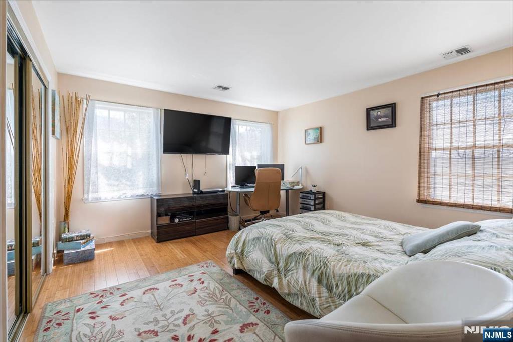 48 Quartz Lane Paterson, NJ 07501 - Photo 9 of 29 a bedroom with a bed and a television