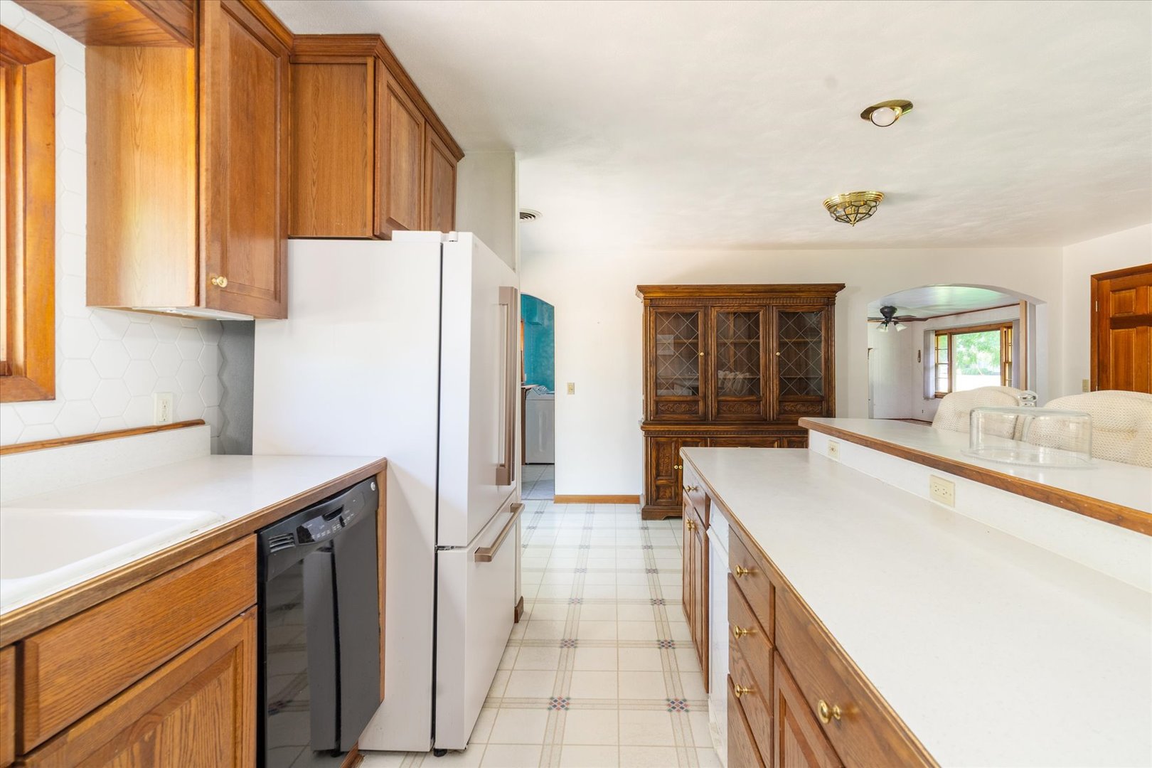 1048 Warren Street Henry, IL 61537 - Photo 15 of 34 a kitchen with a sink a refrigerator and a stove
