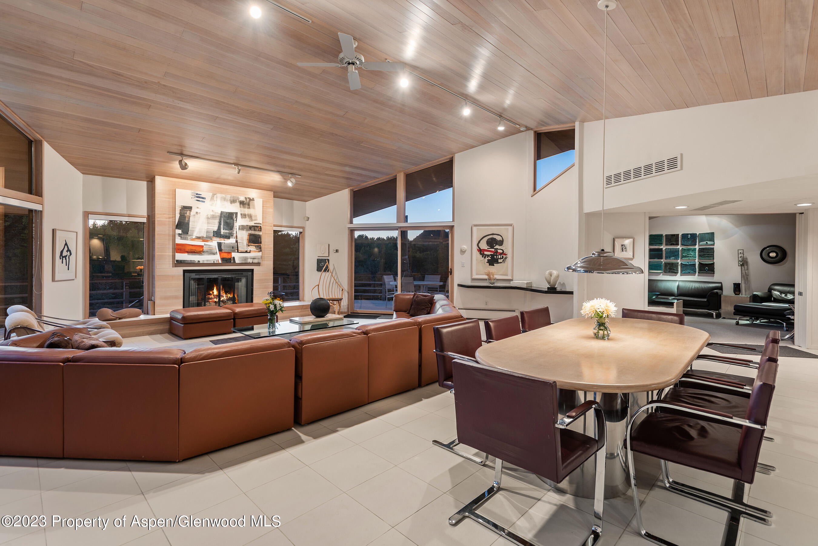 695 Meadows Road Aspen, CO 81611 - Photo 11 of 18 a kitchen with stainless steel appliances granite countertop table chairs stove and sink