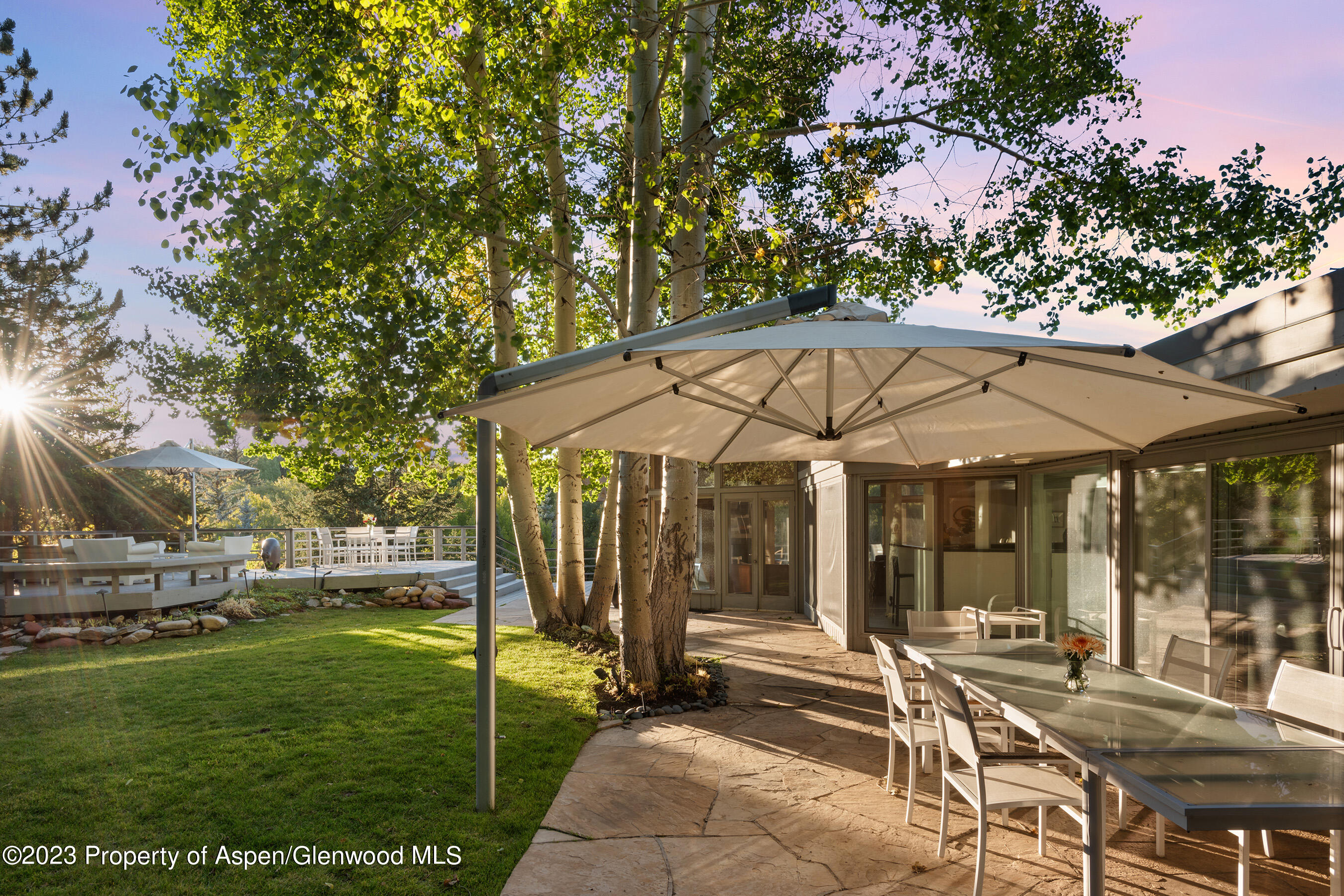 695 Meadows Road Aspen, CO 81611 - Photo 3 of 18 a view of a house with backyard and porch
