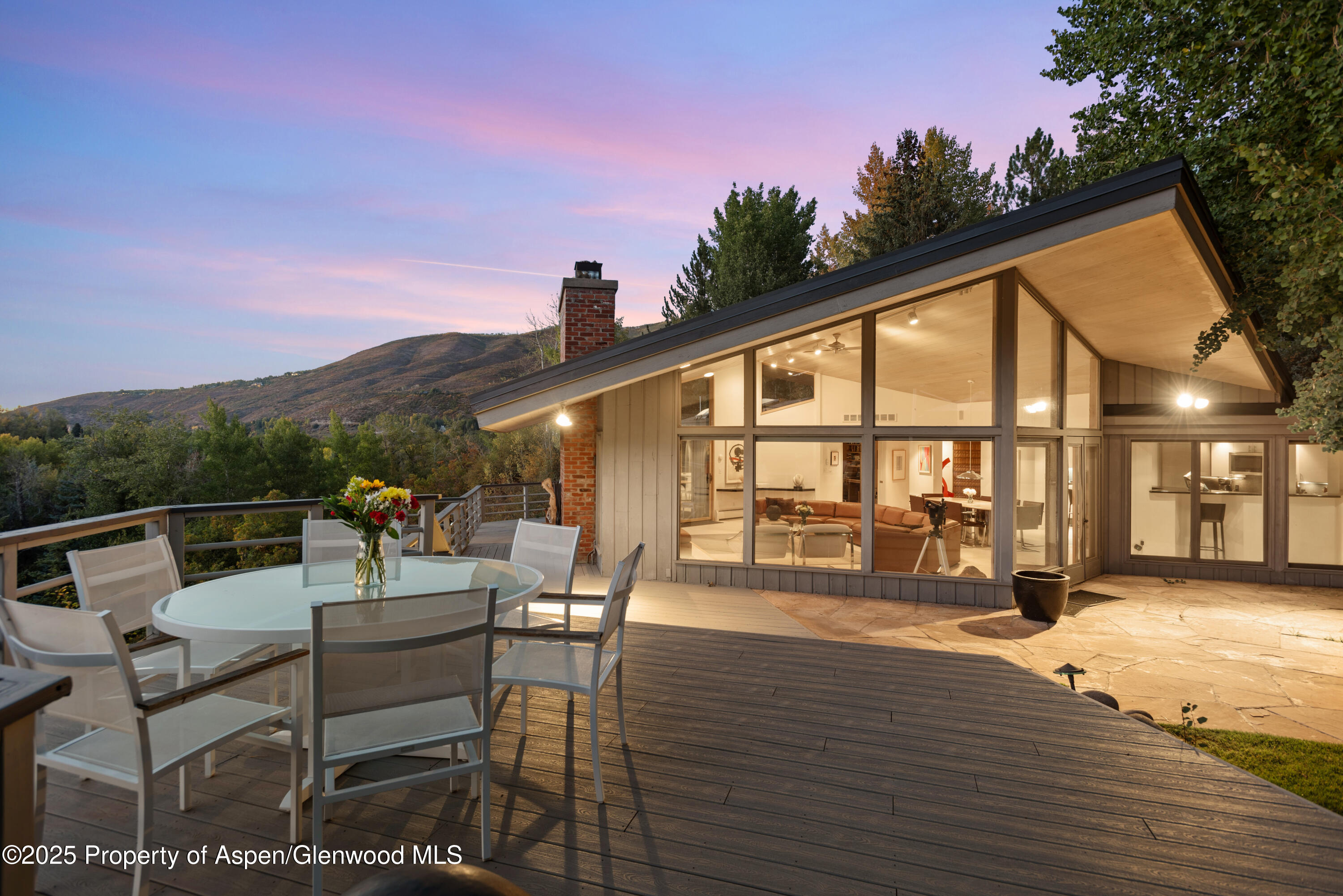 695 Meadows Road Aspen, CO 81611 - Photo 5 of 18 a view of a patio with couches table and chairs and potted plants