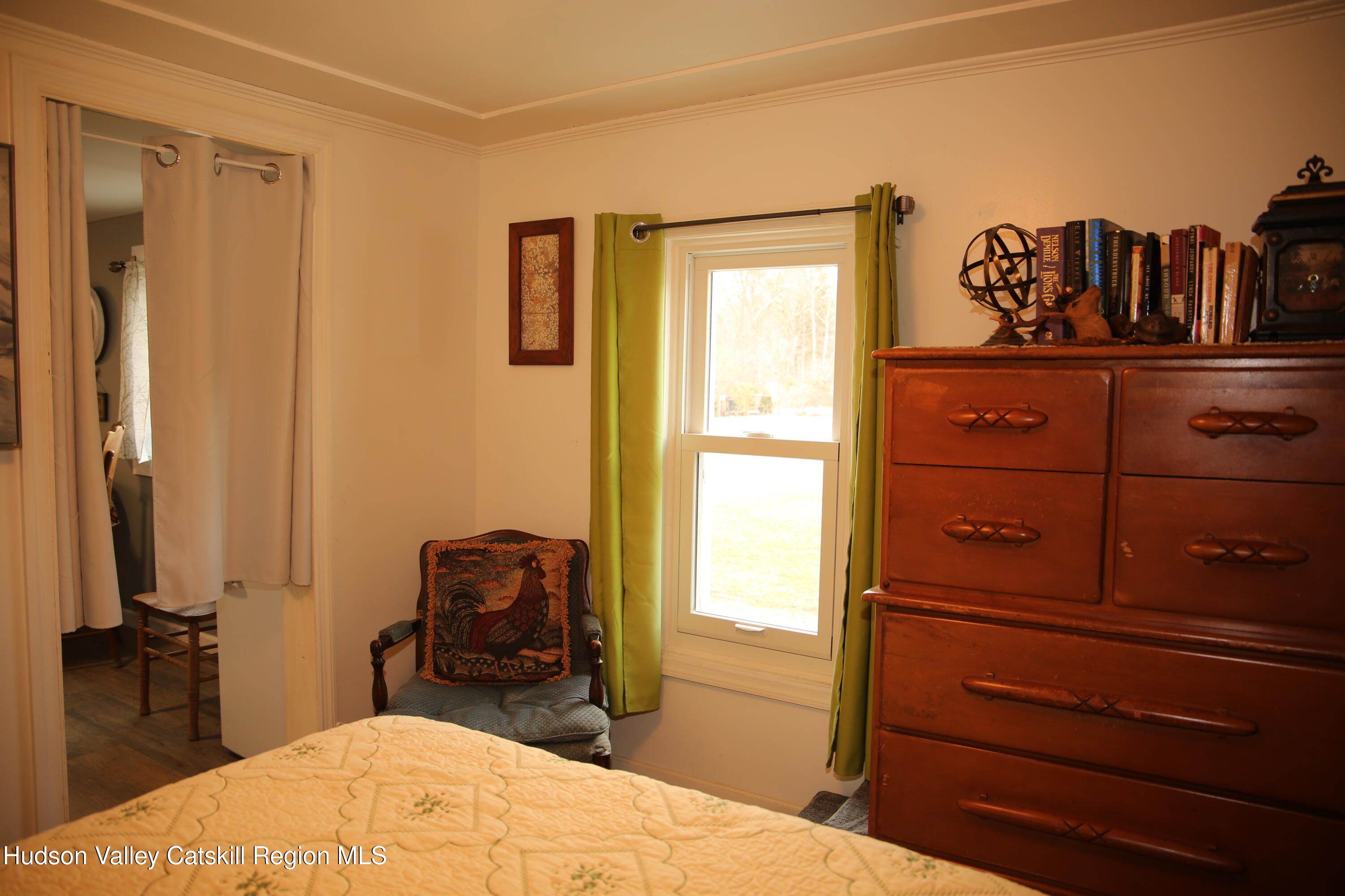 784 Old Rte 28, Unit MAIN STREET WEST OF DEPOT Fleischmanns, NY 12430 - Photo 11 of 19 a bedroom with a bed and a mirror