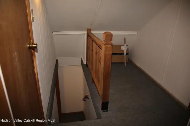 a view of a storage & utility room with refrigerator