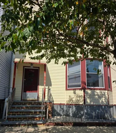 a view of a house with a tree