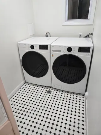 a bathroom with a sink and a washing machine