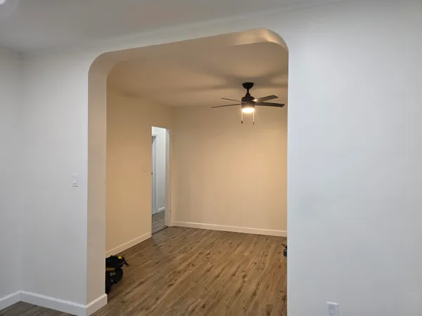 a view of a livingroom with wooden floor
