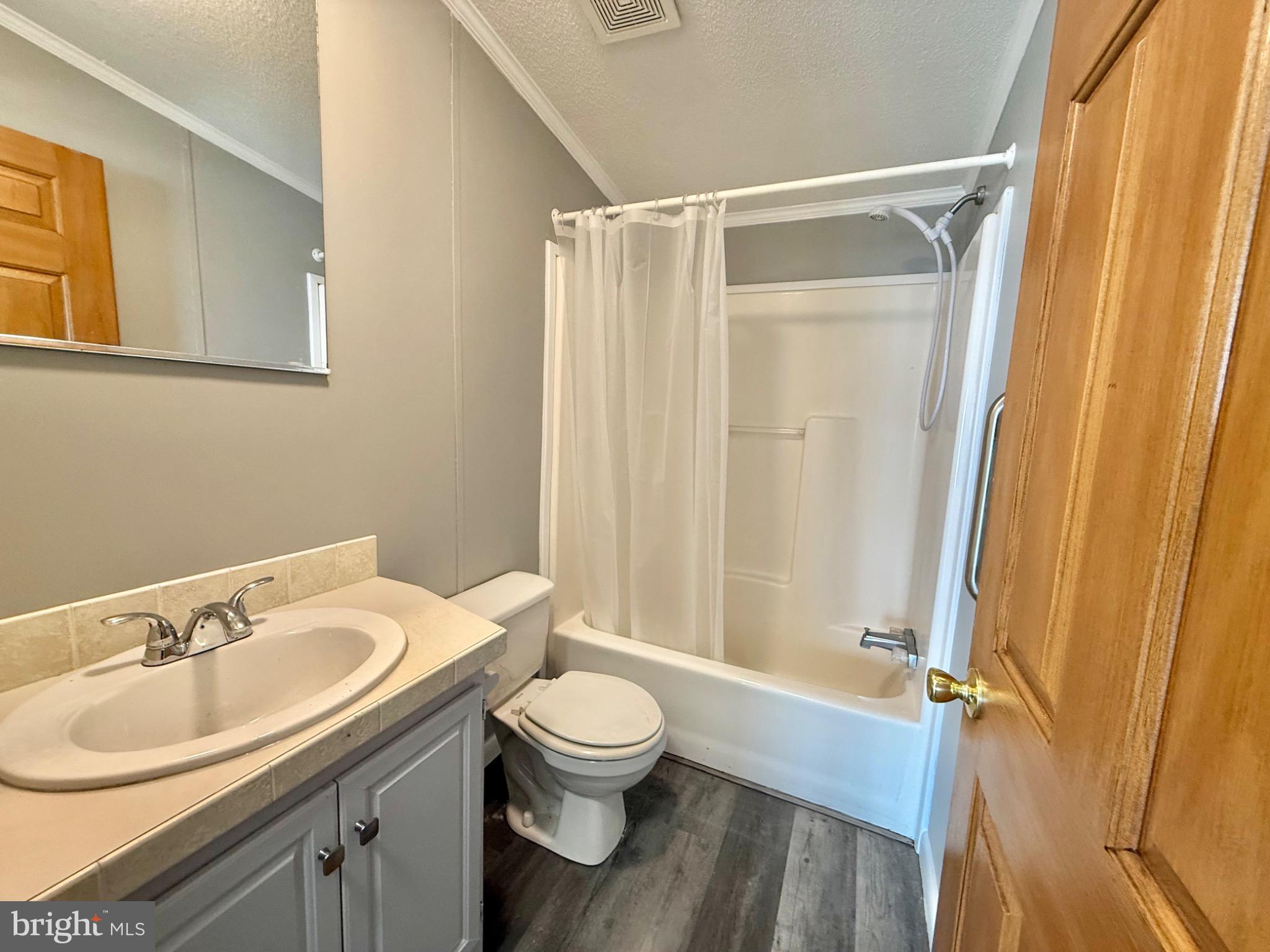 194 Jacobstown New Egypt Road, Unit 2 Wrightstown, NJ 08562 - Photo 14 of 17 a bathroom with a sink toilet and shower