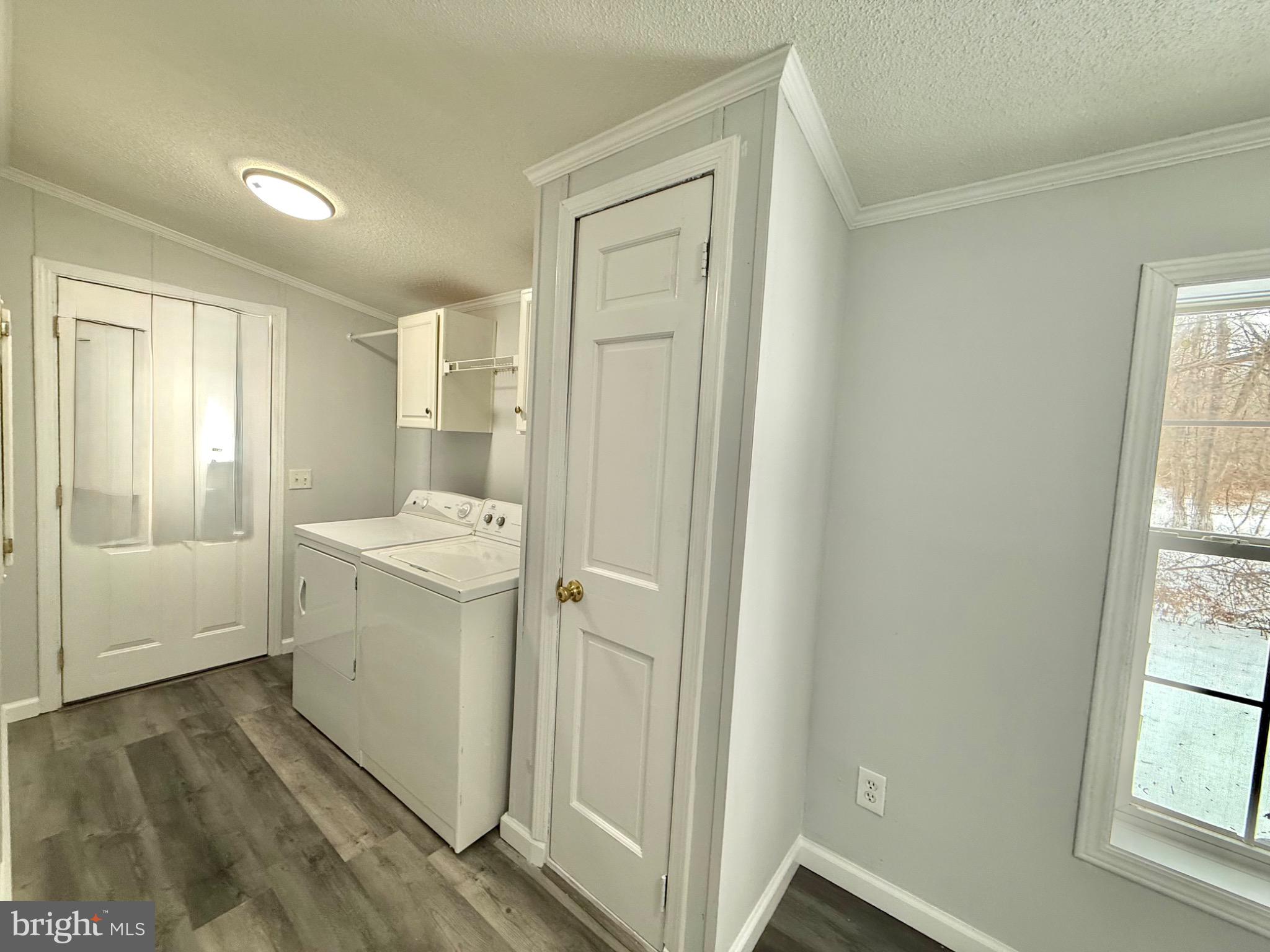 194 Jacobstown New Egypt Road, Unit 2 Wrightstown, NJ 08562 - Photo 17 of 17 a view of utility room with washer and dryer