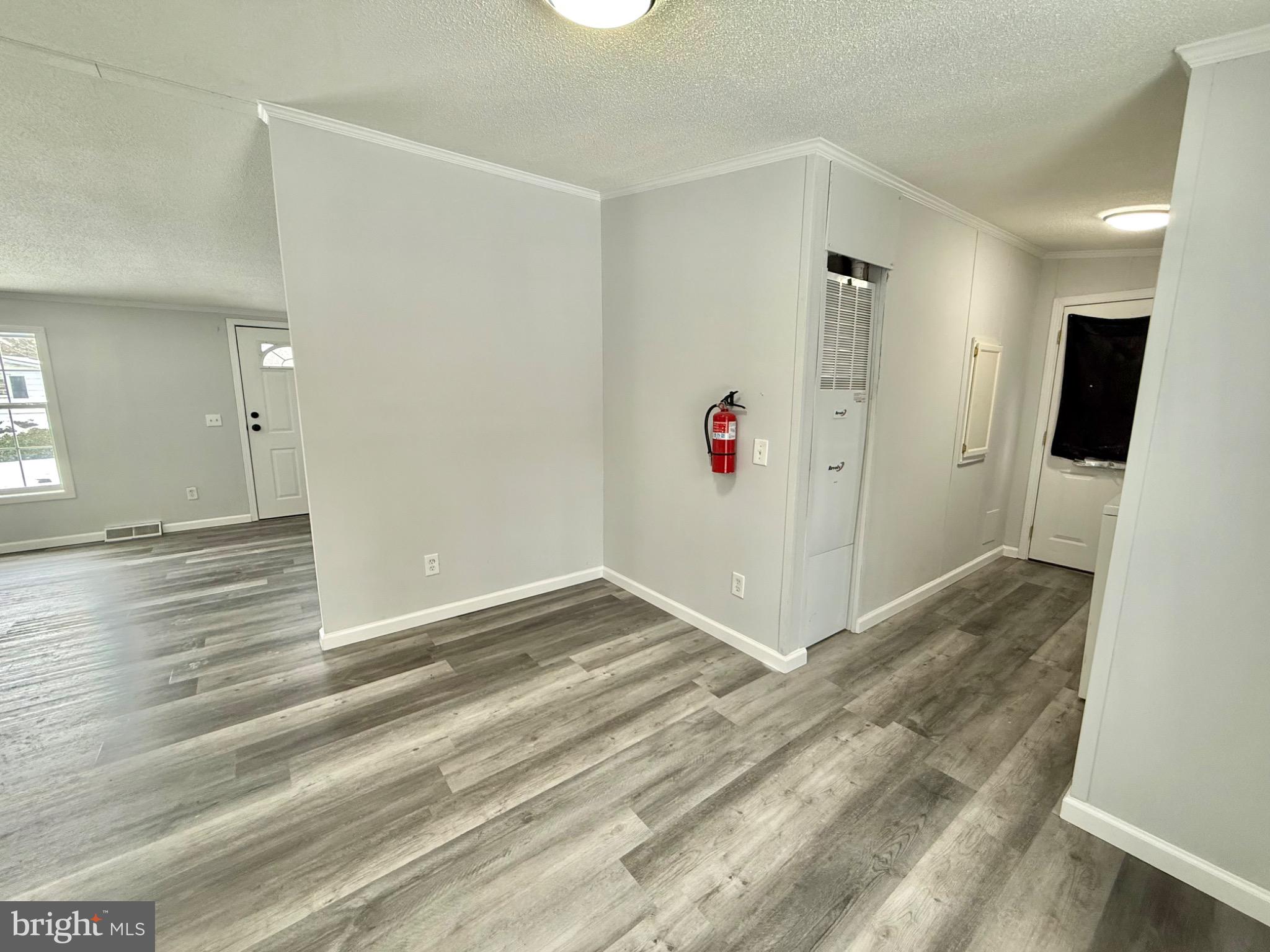194 Jacobstown New Egypt Road, Unit 2 Wrightstown, NJ 08562 - Photo 7 of 17 a view of a hallway with wooden floor and staircase