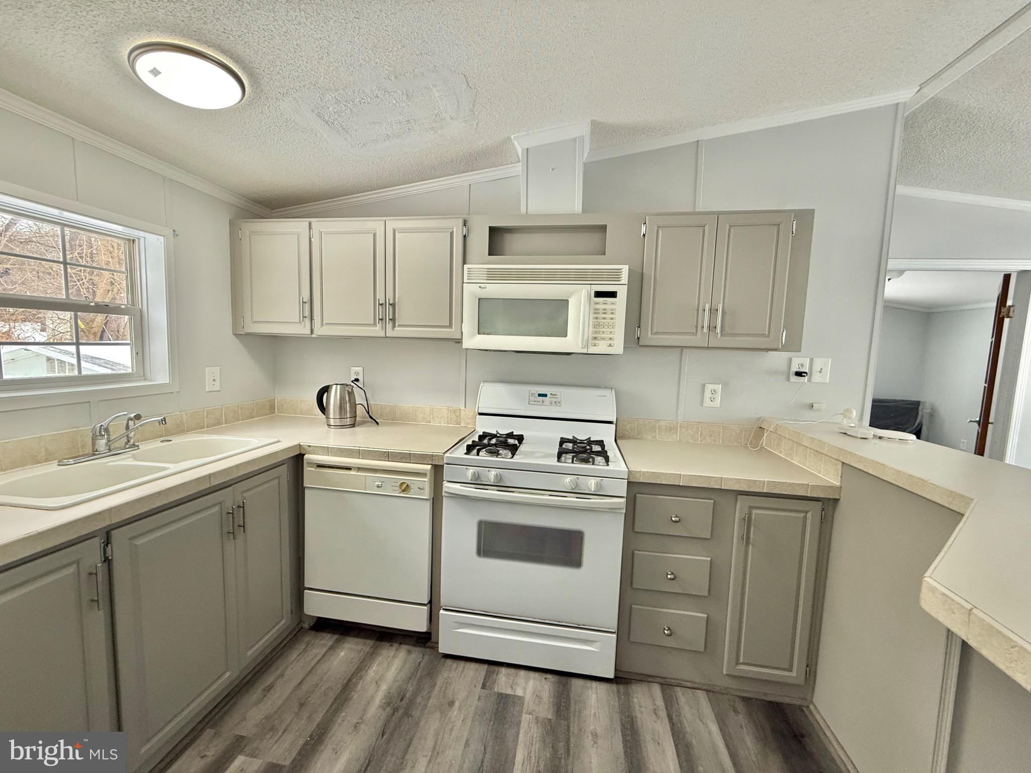 194 Jacobstown New Egypt Road, Unit 2 Wrightstown, NJ 08562 - Photo 10 of 17 a kitchen with a sink stove and cabinets
