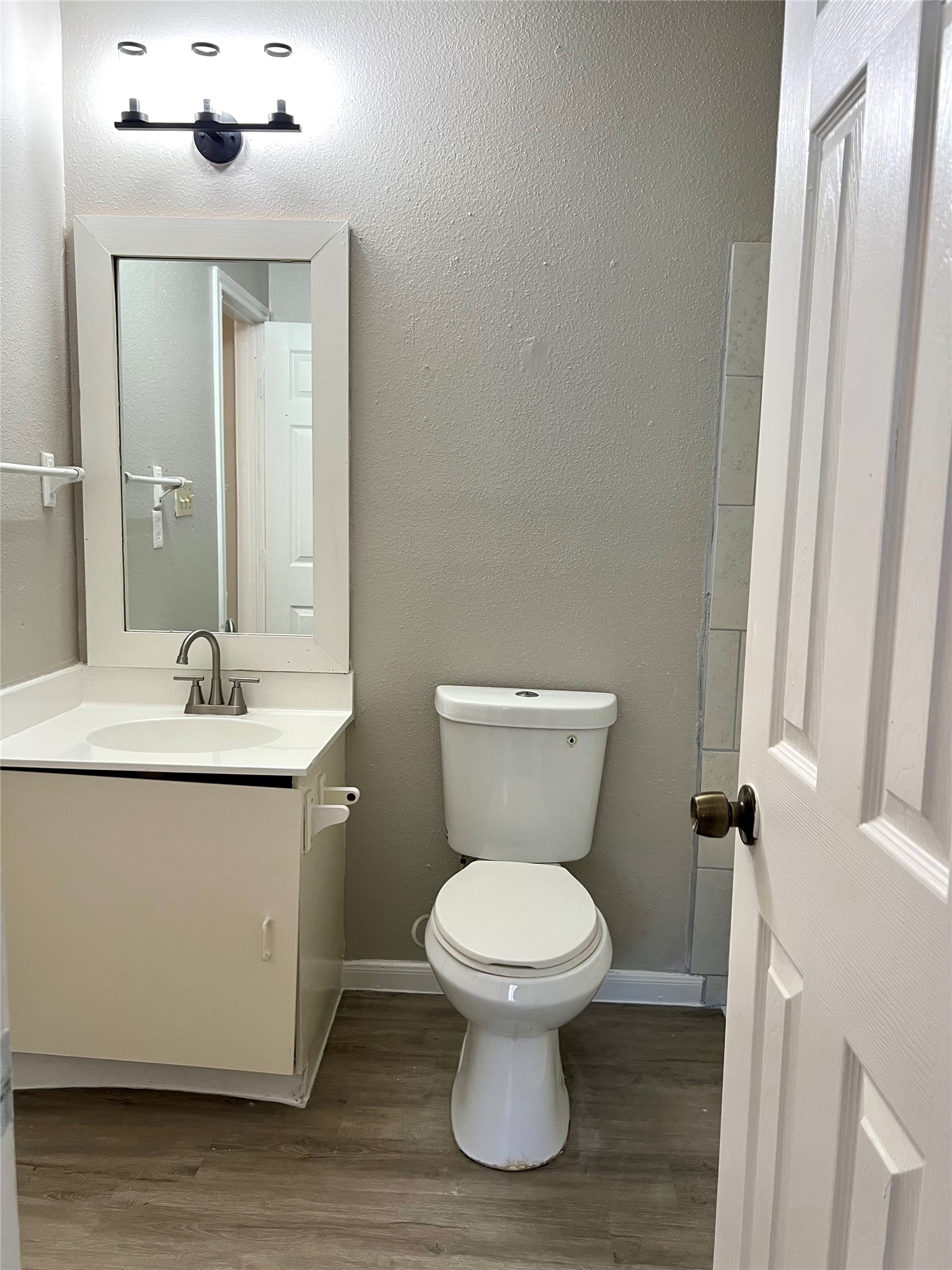 3221 Hirschfield Road, Unit C Spring, TX 77373 - Photo 13 of 22 a bathroom with a toilet sink and mirror