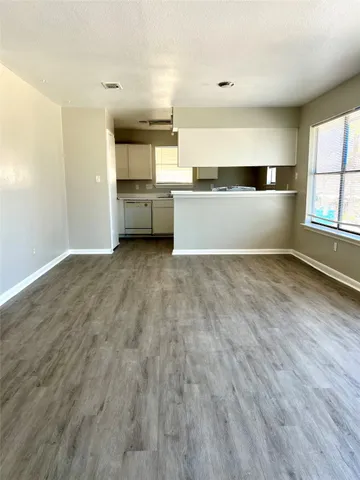 a view of a kitchen with microwave and cabinets