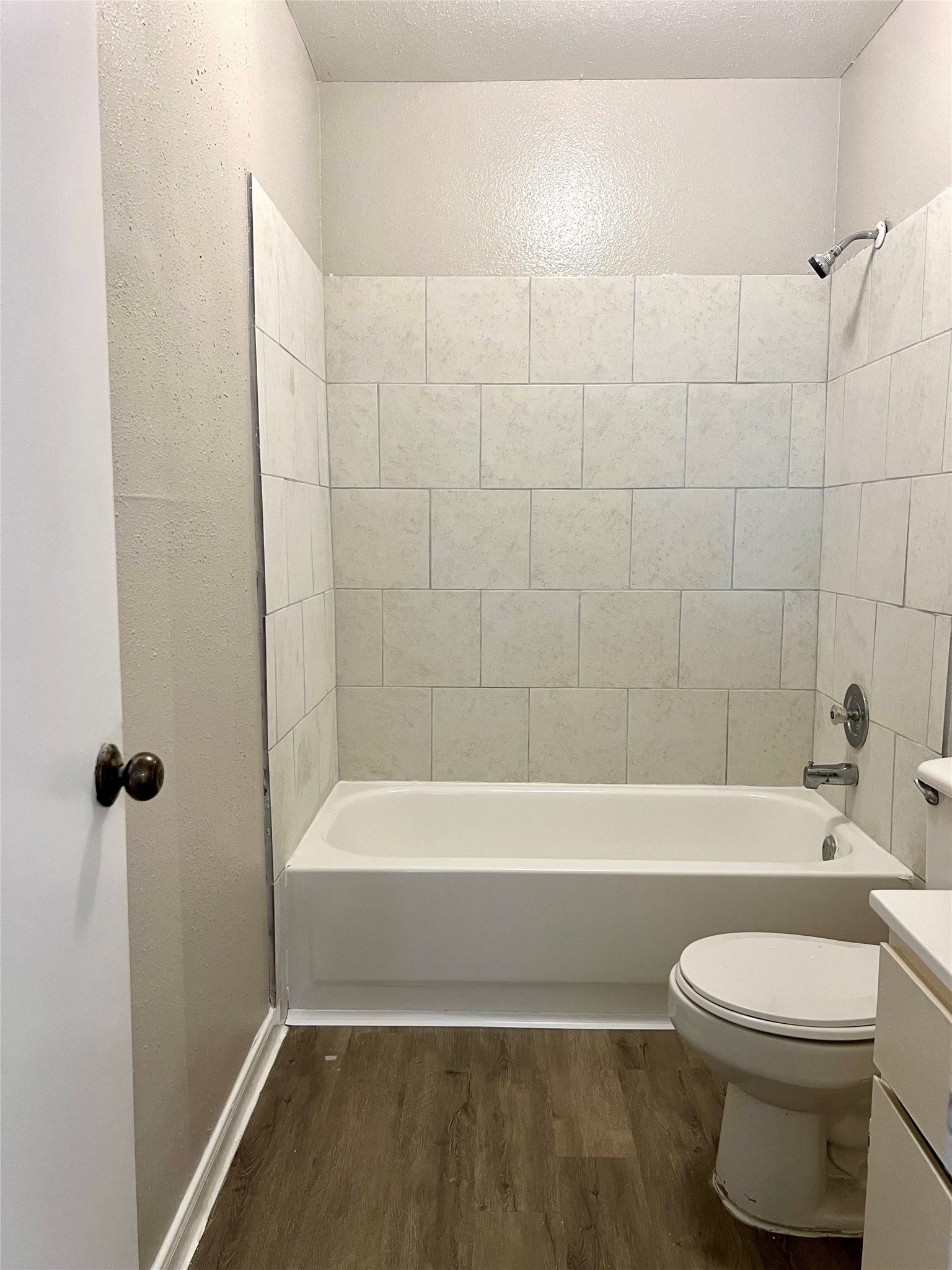 3221 Hirschfield Road, Unit C Spring, TX 77373 - Photo 7 of 22 a bathroom with a toilet and a bath tub