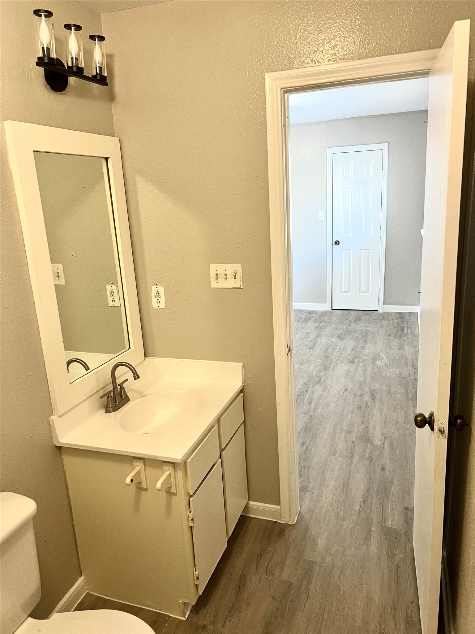 3221 Hirschfield Road, Unit C Spring, TX 77373 - Photo 9 of 22 a bathroom with a sink and mirror with toilet