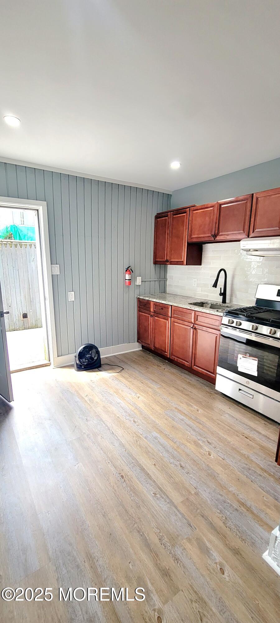 2402 Auburn Terrace, Unit B Atlantic City, NJ 08401 - Photo 1 of 6 a living room with furniture and a wooden floor