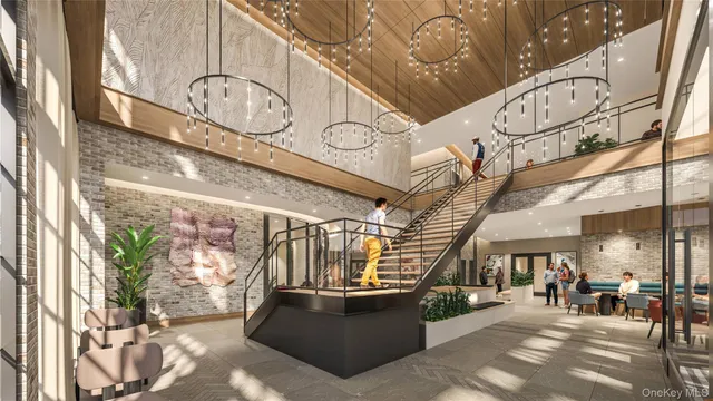 a living room with lots of furniture and a chandelier