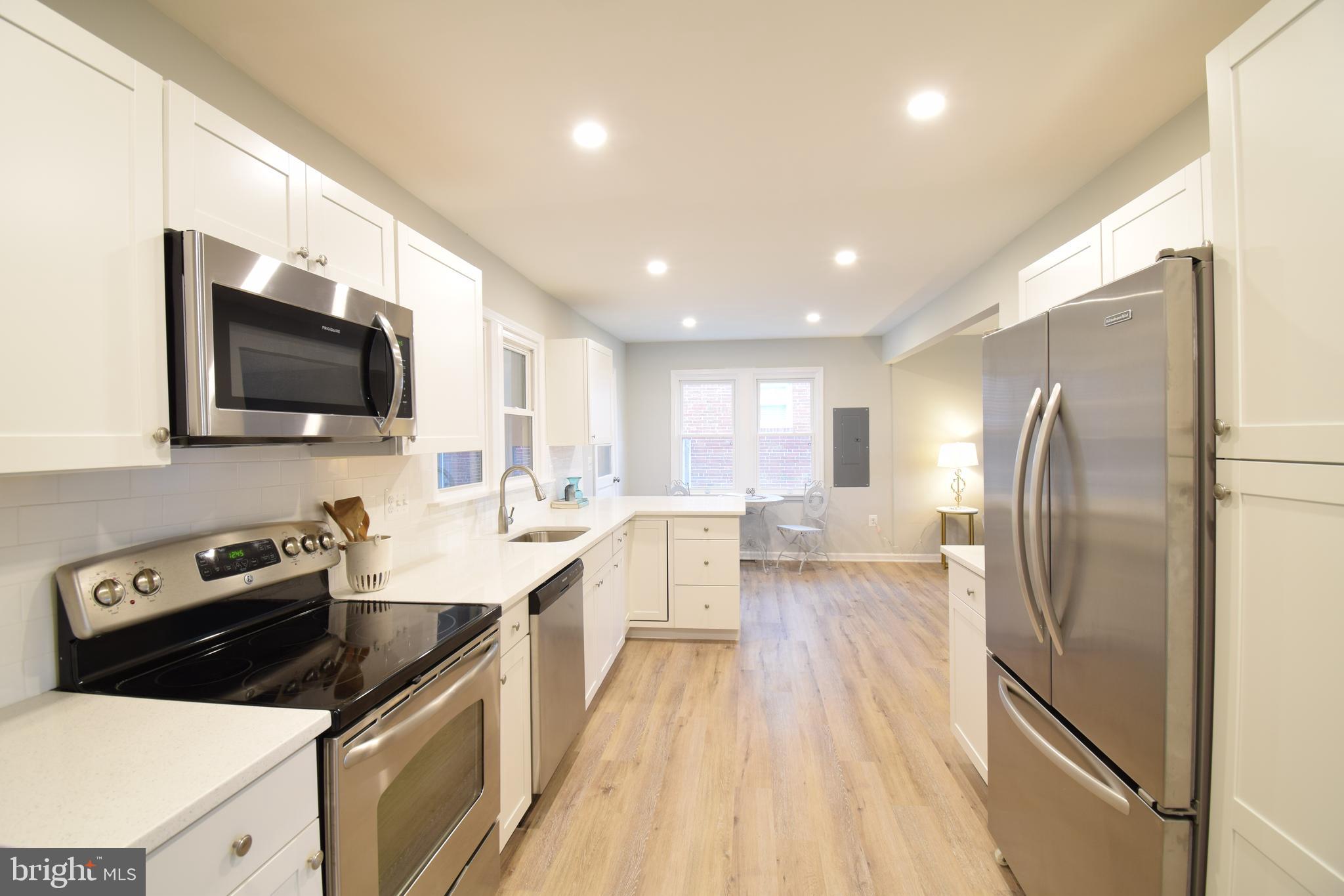 180 Dale Road Pasadena, MD 21122 - Photo 6 of 25 White cabinets stainless steel appliances &pantry
