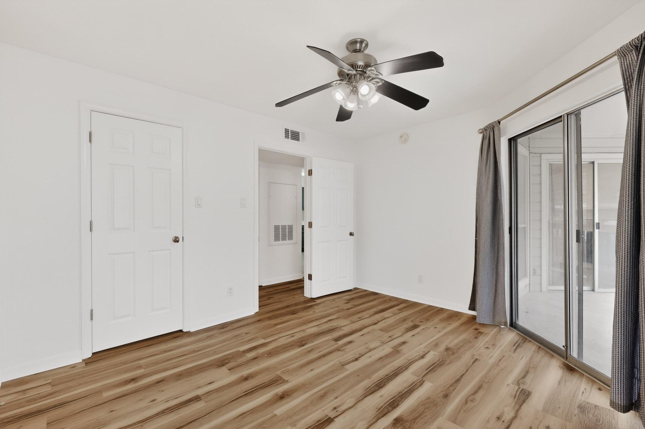 2450 Wickersham Lane, Unit 904 Austin, TX 78741 - Photo 18 of 35 a view of empty room with wooden floor